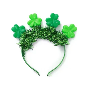 St. Patrick's Day green shamrock headband with glowing LEDs and tinsel details for festive party wear
