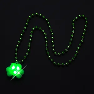 St. Patrick's Day green bead necklace with glowing LED shamrock pendant for party celebration.
