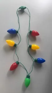 Christmas party LED flashing light necklace with colorful oversized bulb pendants for festive mood.