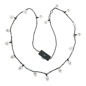Close-up detail of Halloween glowing skull string lights, perfect for spooky party decor.
