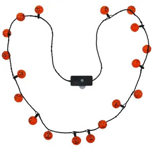 Halloween glowing pumpkin necklace LED light-up spooky holiday party costume accessory.