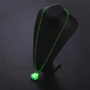 St. Patrick's Day green bead necklace with glowing LED shamrock pendant for holiday party decor.
