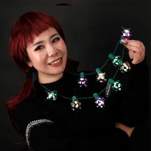 Detailed view of the glowing LED disco ball necklace with colorful flashing light effects.