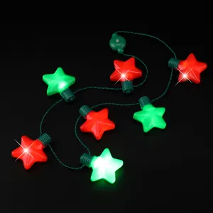 Detail view of glowing Christmas star LED necklace string lights with red and green stars.
