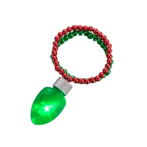 Close-up detail of Christmas LED glowing bulb bracelet with red and green bead chain for party.