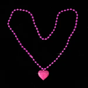 Pink LED heart necklace detail shot, glowing bead pendant for Valentine day party accessory.