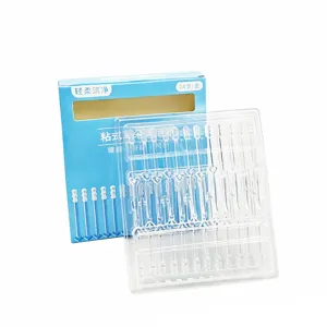 Detailed view of disposable transparent sticky ear cleaning sticks with soft adhesive tips.