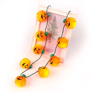Halloween LED pumpkin string lights necklace for party decoration, glowing 9-LED holiday accessory.