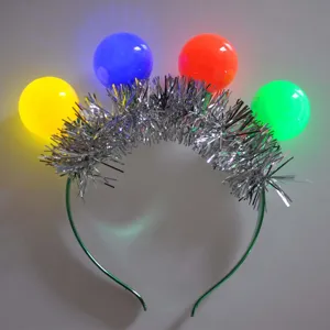 Christmas light up tinsel headband with four colorful glowing LED balls for party celebration.