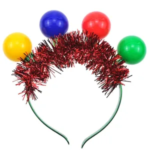 Christmas headband detail showing red tinsel and colorful LED spherical lights festive prop