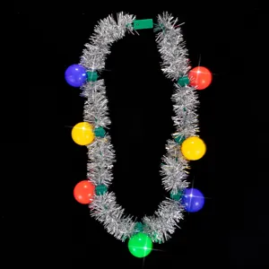 Light-up Christmas tinsel necklace detail shot, colorful bulb charms with silver garland.