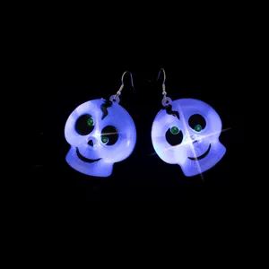 Halloween LED glowing skull earrings, novelty light-up ghost drop earrings for party gifts.