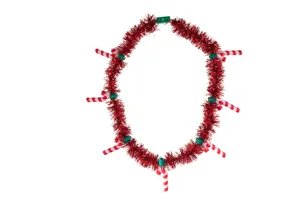 Close-up detail of the red Christmas tinsel necklace featuring candy cane pendants and green beads.