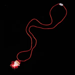 LED light up Christmas necklace with Santa Claus pendant, red cord and glowing party prop.