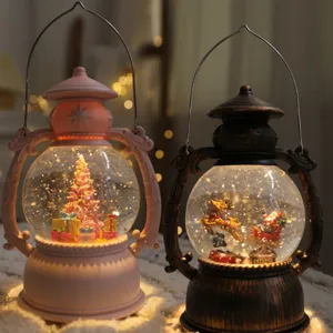 Christmas snow globe lantern decorative light with pink tree and vintage santa figures.