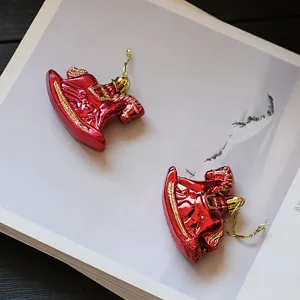Red rocking horse Christmas hanging ornaments for holiday tree home decor party display.
