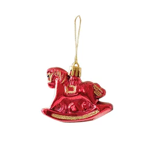 Red Christmas rocking horse ornament with gold glitter details, perfect for holiday tree hanging.