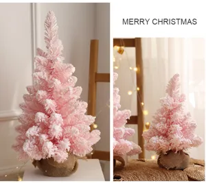 Roze kerstboom tafeldecoratie met jute basis voor feestelijke binnenhuis inrichting thuis