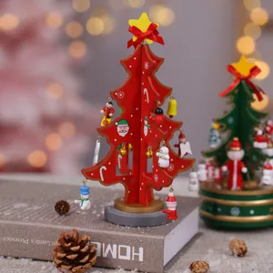 Wooden Christmas tree tabletop decoration with cute hanging ornaments and star topper for holiday.
