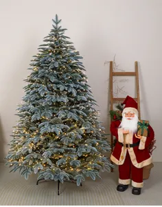 Grande albero di Natale artificiale in PE illuminato con luci e statuetta di Babbo Natale.