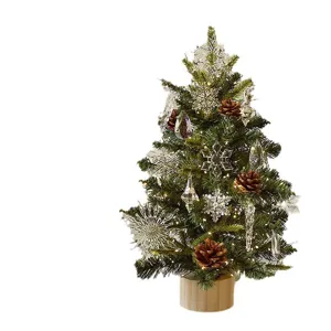 Künstlicher Mini Weihnachtsbaum mit Kristallanhängern, Zapfen und LED Lichtern für Tischdekoration.