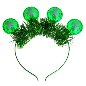 St. Patrick's Day green clover light-up headband with tinsel and faceted sphere ornaments for party.