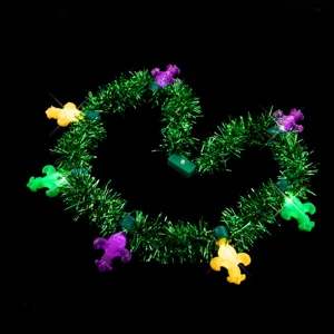 Mardi Gras LED tinsel necklace with green garland and glowing fleur-de-lis lights.