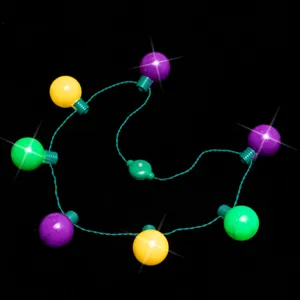 Closeup detail of colorful LED glowing light necklace with purple yellow green bulbs for party props.