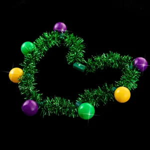 Mardi Gras LED light up tinsel necklace detail shot with colorful glowing bulbs and green garland.