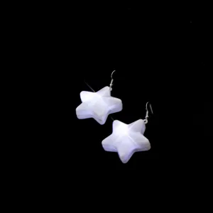 Glowing star earrings with LED light pendant, perfect for party and festive holiday wear.