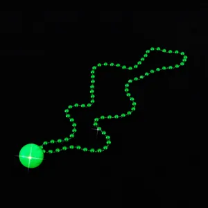 Glow in the dark party necklace with bright green glowing ball pendant and bead chain for club events.