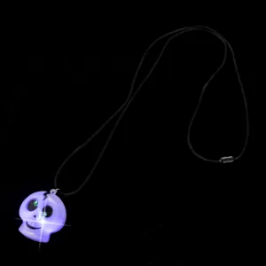 Halloween glowing skull pendant necklace with LED lights and black cord for party decoration.