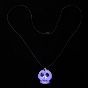 Close-up detail of the glowing skull pendant necklace, featuring bright LED lights and rope.