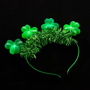 St. Patrick's Day LED glowing clover headband with green tinsel, festive party hair accessory.