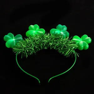 LED St. Patrick's Day clover glowing headband with green tinsel, festive party hair hoop.