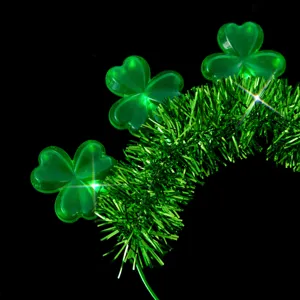 Green St. Patrick's Day lighted shamrock headband detail view with glowing LED clover design.