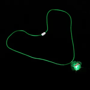 Green glowing pendant necklace detailed view, LED luminous sweater accessory with green cord.