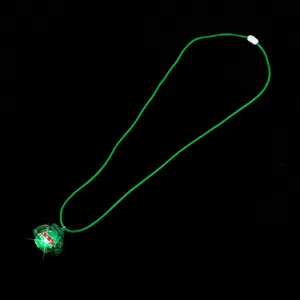 Green light-up sweater pendant necklace with hanging cord for festive holiday party