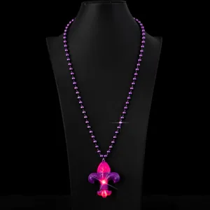 LED light-up carnival party necklace detail view with purple beads and glowing pendant.