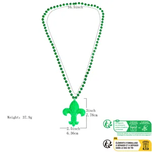 Green bead necklace with Fleur-de-lis pendant, carnival party decoration prop detail view.