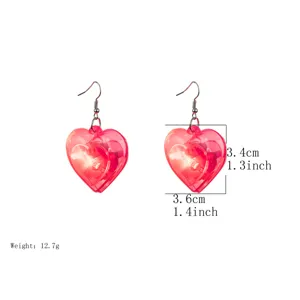Transparent pink heart-shaped LED glowing earrings, perfect for Valentine's Day party.