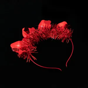 Close-up detail view of the glowing red heart LED tinsel headband for Valentine party fun.