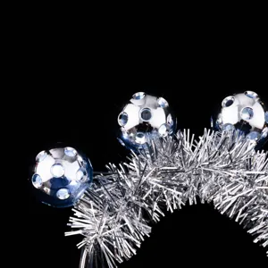 Silver tinsel LED glowing headband detail shot, sparkling disco ball hair hoop for festival.