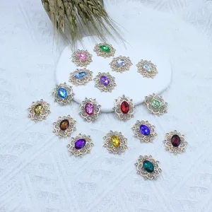Close-up detail of alloy rhinestone flower charm pendants for DIY handmade hair accessories.