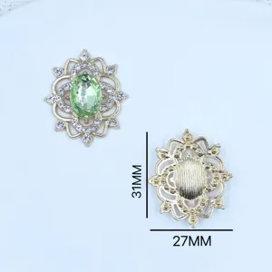 Alloy hollow rhinestone pendant detail view showing front gem and back dimension 31x27mm.