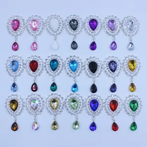 Close-up of sparkling rhinestone acrylic pendant details, silver metal base, vibrant colors.