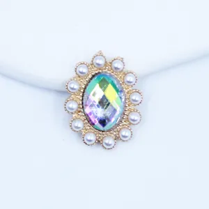 Detail shot of 20x25mm oval pearl sunflower alloy rhinestone button for DIY crafts decoration.