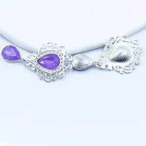 Silver hollow shield pendant DIY accessory with purple rhinestone for apparel crafting.
