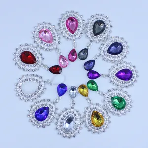 Detailed view of silver alloy rhinestone acrylic teardrop pendant charms for DIY fashion crafts.