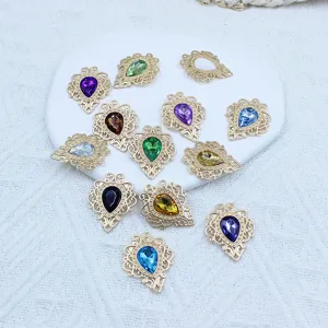 Detailed view of teardrop filigree alloy base acrylic rhinestone DIY jewelry crafting charms.